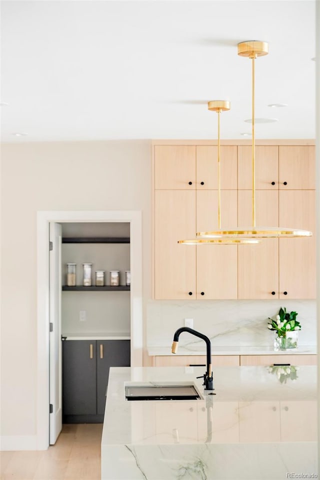 1462 S Vine St, Denver, CO 80210 - kitchen featuring light brown cabinets and light stone countertops