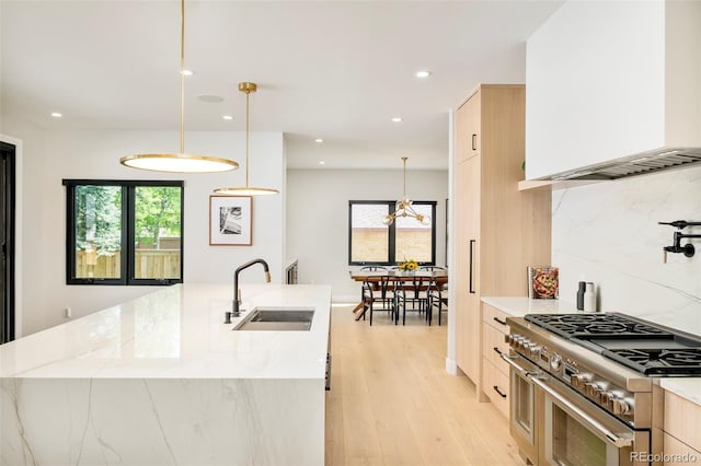 1462 S Vine St, Denver, CO 80210 - kitchen featuring double oven range, light brown cabinets, modern cabinets, recessed lighting, and plenty of natural light