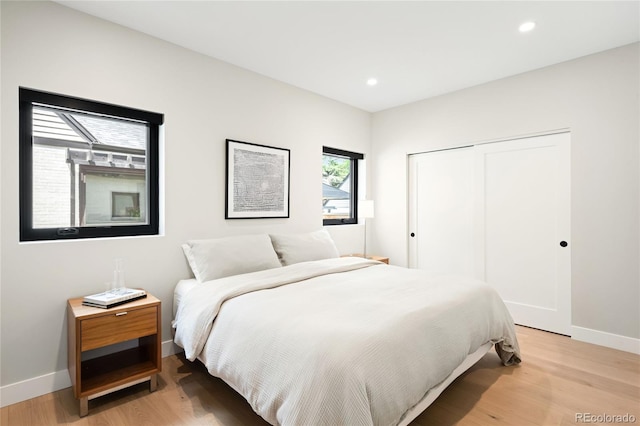 1462 S Vine St, Denver, CO 80210 - bedroom featuring a closet, light wood finished floors, and recessed lighting