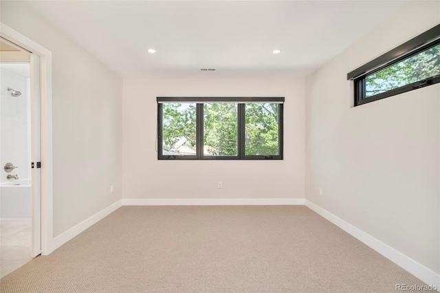 1462 S Vine St, Denver, CO 80210 - carpeted empty room with healthy amount of natural light and recessed lighting
