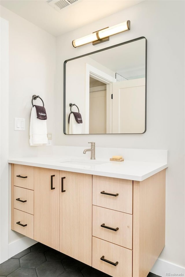 1462 S Vine St, Denver, CO 80210 - bathroom featuring vanity and tile patterned floors