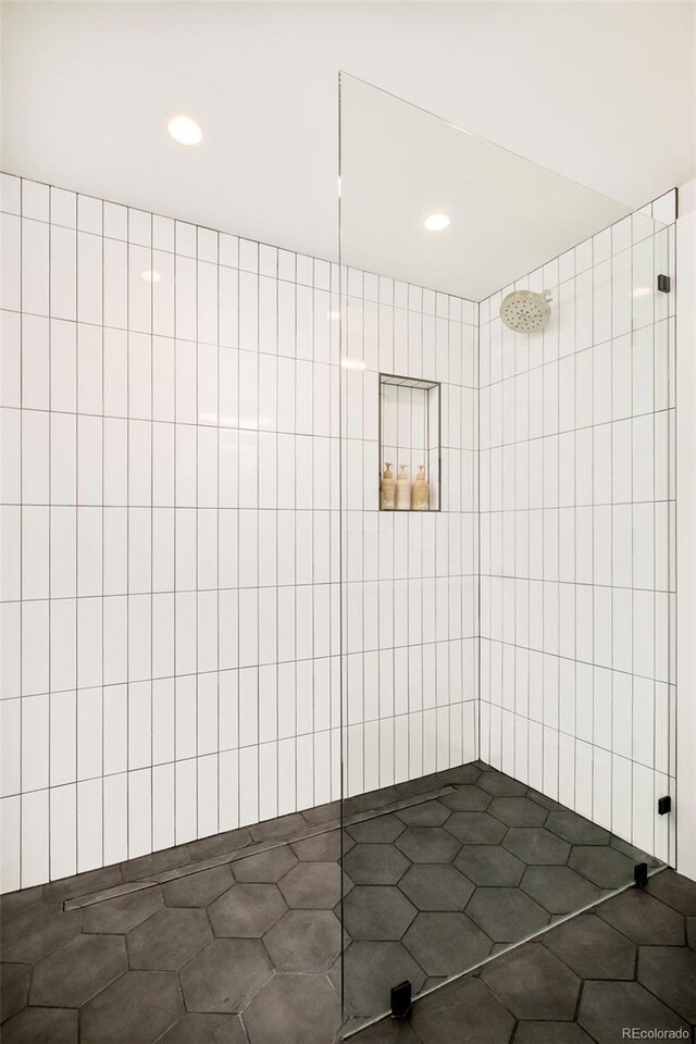 1462 S Vine St, Denver, CO 80210 - bathroom featuring tiled shower, recessed lighting, and tile patterned flooring
