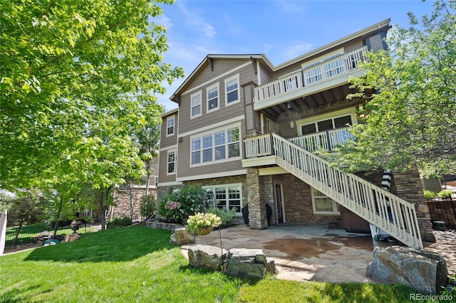 7963 S Valleyhead Way, Aurora, CO 80016 - rear view of property with stone siding, stairs, and a patio