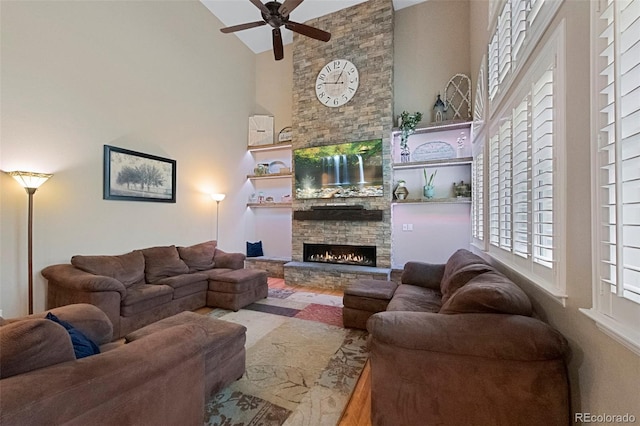 20460 Oakbrook Ln, Parker, CO 80138 - living room with high vaulted ceiling, a stone fireplace, and ceiling fan