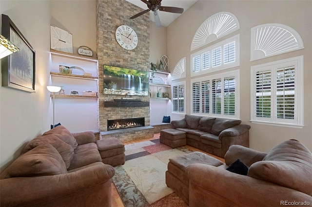 20460 Oakbrook Ln, Parker, CO 80138 - living area with a high ceiling, a fireplace, and ceiling fan