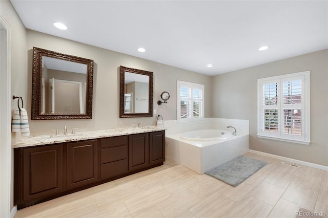 20460 Oakbrook Ln, Parker, CO 80138 - full bath with healthy amount of natural light, a garden tub, double vanity, and recessed lighting