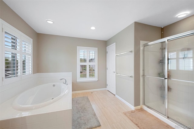 20460 Oakbrook Ln, Parker, CO 80138 - full bathroom featuring a stall shower, baseboards, a garden tub, and recessed lighting