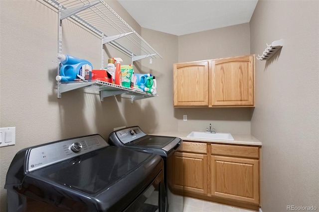 20460 Oakbrook Ln, Parker, CO 80138 - clothes washing area featuring washing machine and clothes dryer and cabinet space