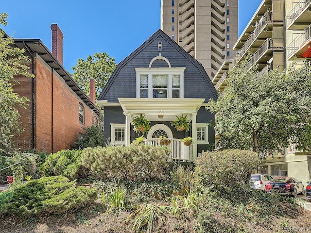 view of front of home featuring a balcony