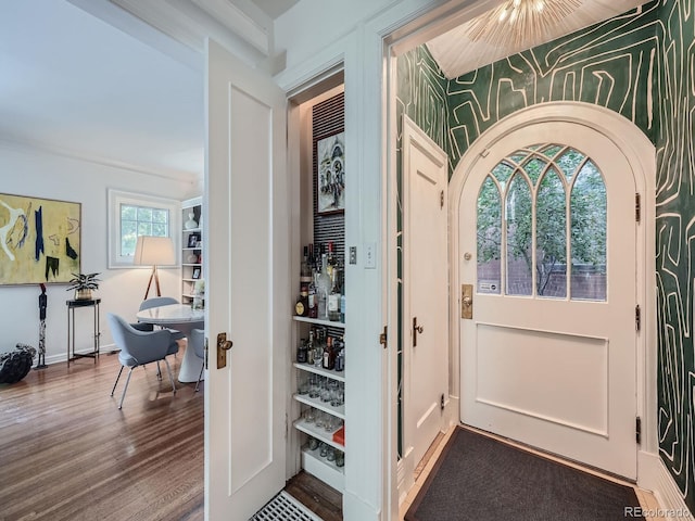 doorway to outside featuring hardwood / wood-style floors and a healthy amount of sunlight