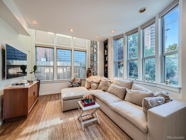 living room with light hardwood / wood-style flooring