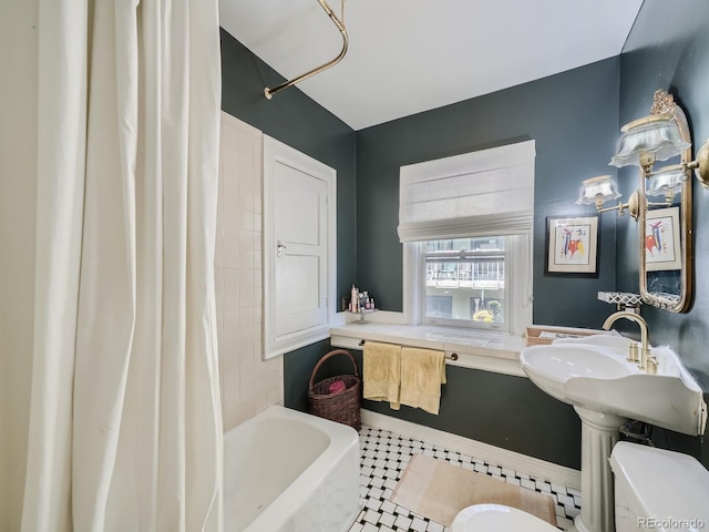 bathroom with tile patterned flooring, toilet, and shower / bath combo