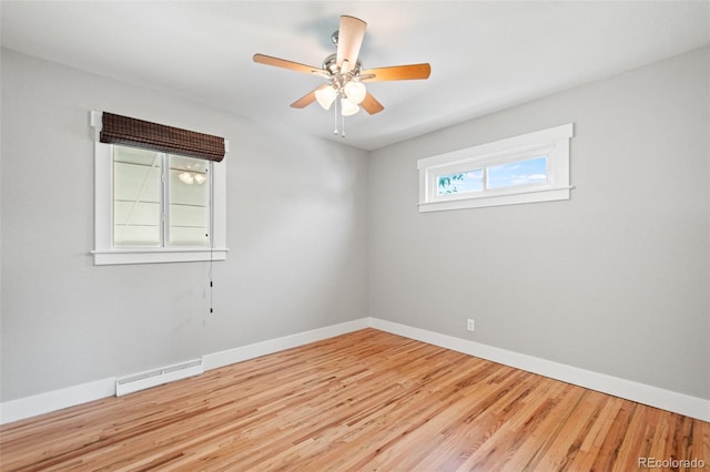 335 N 11th Ave, Brighton, CO 80601 - empty room with baseboards, wood finished floors, ceiling fan, and baseboard heating