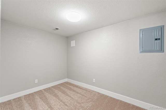 335 N 11th Ave, Brighton, CO 80601 - spare room with electric panel, a textured ceiling, carpet, and baseboards
