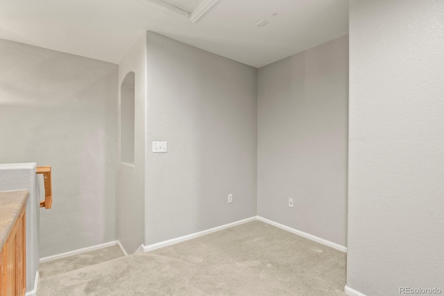 spare room with light colored carpet