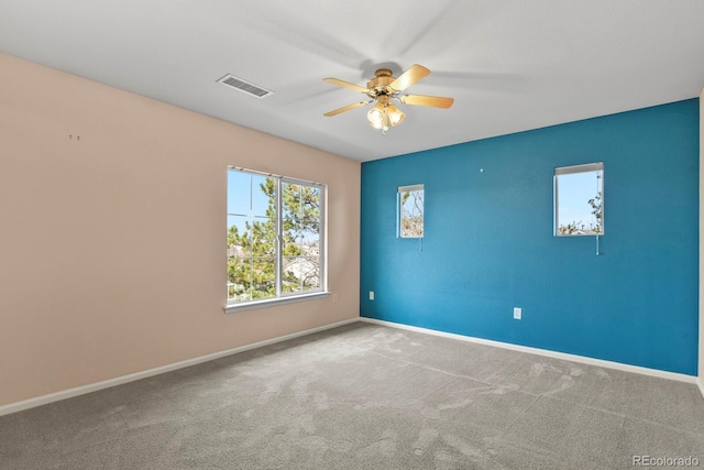 unfurnished room featuring carpet flooring and ceiling fan