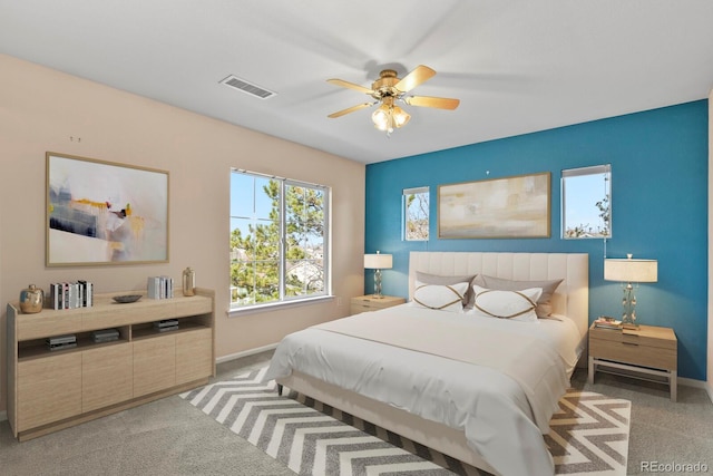 carpeted bedroom with ceiling fan