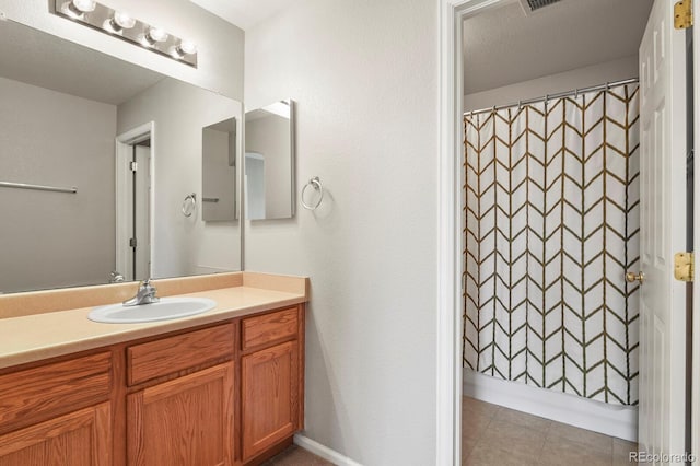 bathroom with vanity and curtained shower