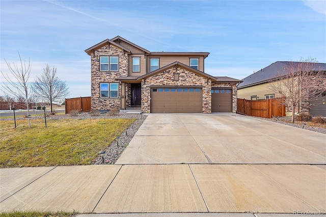 view of front of home with a front yard and a garage