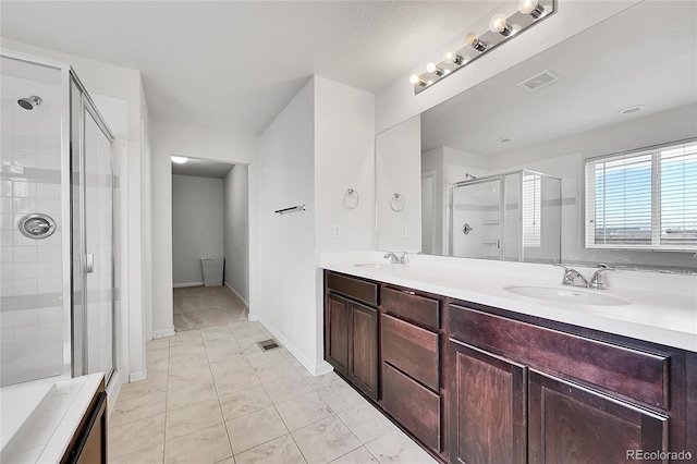 bathroom with vanity and an enclosed shower