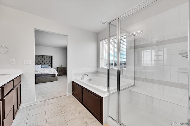 bathroom featuring tile patterned flooring, vanity, and plus walk in shower