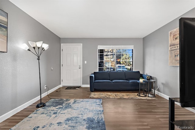 living room with dark hardwood / wood-style floors