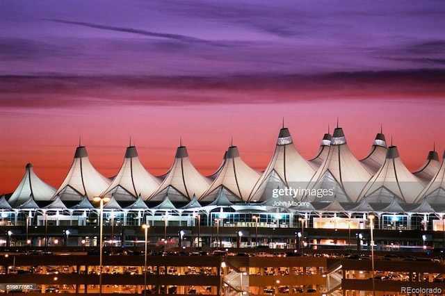 view of outdoor building at dusk