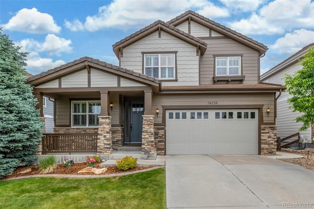 14258 Greenfield Loop, Parker, CO 80134 - craftsman-style house with a garage, stone siding, driveway, covered porch, and a tiled roof