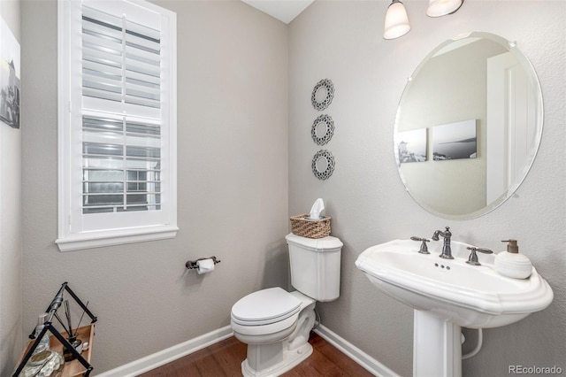 14258 Greenfield Loop, Parker, CO 80134 - half bath with wood finished floors, toilet, and baseboards