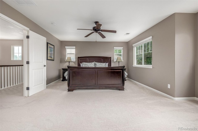 14258 Greenfield Loop, Parker, CO 80134 - bedroom featuring light colored carpet, multiple windows, and baseboards