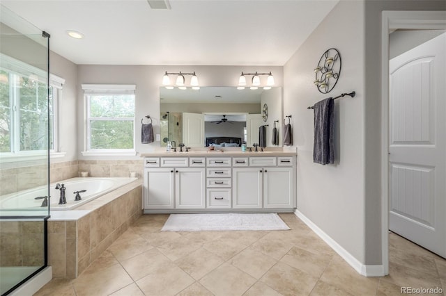 14258 Greenfield Loop, Parker, CO 80134 - full bath featuring double vanity, a garden tub, a ceiling fan, tile patterned flooring, and recessed lighting