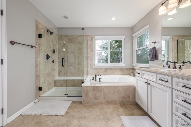 14258 Greenfield Loop, Parker, CO 80134 - full bath featuring vanity, a garden tub, a shower stall, tile patterned flooring, and recessed lighting