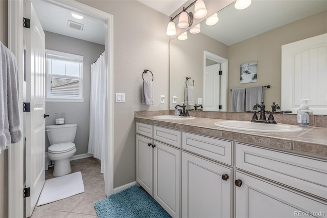 14258 Greenfield Loop, Parker, CO 80134 - full bathroom with double vanity, toilet, and tile patterned floors
