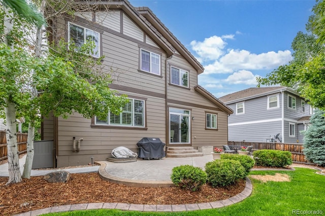 14258 Greenfield Loop, Parker, CO 80134 - back of house featuring entry steps and a patio area