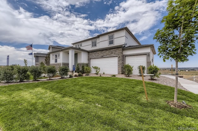 view of front of home with a garage and a front yard