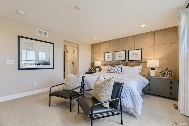 carpeted bedroom with connected bathroom