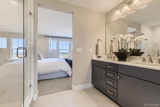 bathroom with walk in shower, plenty of natural light, tile patterned flooring, and vanity