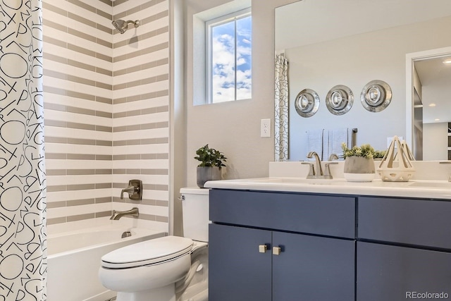 full bathroom with vanity, shower / tub combo, and toilet