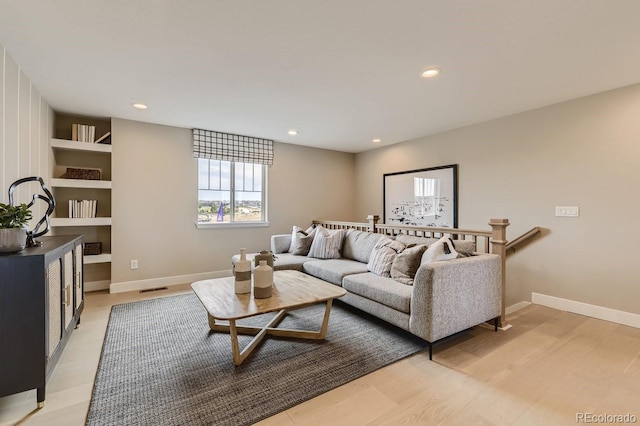 living room with light hardwood / wood-style flooring