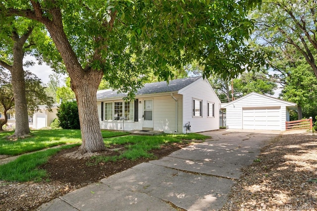 2571 S Birch St, Denver, CO 80222 - single story home with a garage, an outbuilding, concrete driveway, a front yard, and a shingled roof