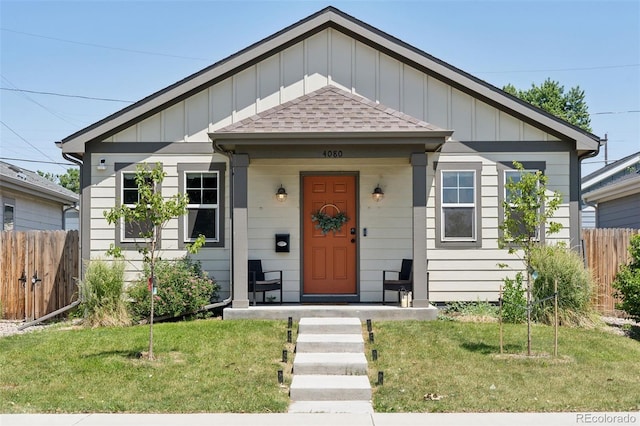 4080 Adams St, Denver, CO 80216 - bungalow with board and batten siding and roof with shingles