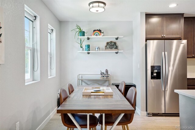 4080 Adams St, Denver, CO 80216 - dining room with baseboards, light wood finished floors, and recessed lighting