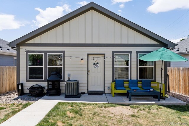 4080 Adams St, Denver, CO 80216 - view of front of home featuring board and batten siding and central AC unit