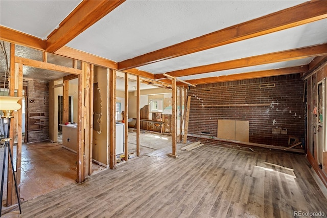660 K Ave, Limon, CO 80828 - unfurnished living room featuring wood finished floors and beam ceiling