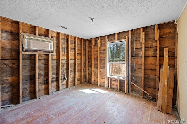 660 K Ave, Limon, CO 80828 - misc room featuring wood walls, visible vents, and a textured ceiling