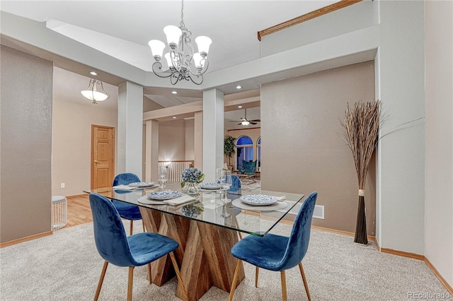 dining space with recessed lighting, baseboards, a chandelier, and light carpet