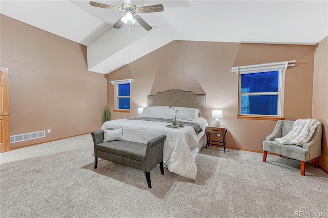 bedroom featuring visible vents, carpet floors, baseboards, ceiling fan, and vaulted ceiling