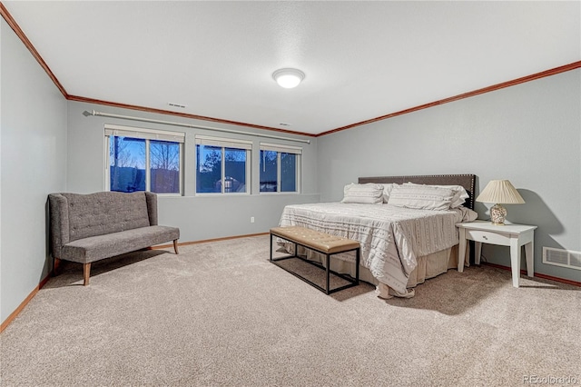 bedroom with crown molding, carpet, visible vents, and baseboards