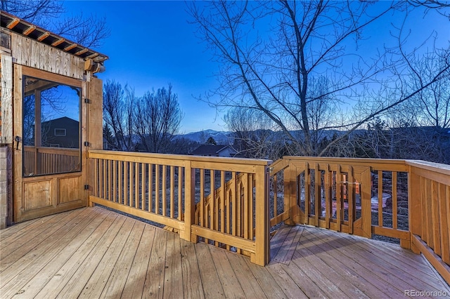 wooden deck with a mountain view