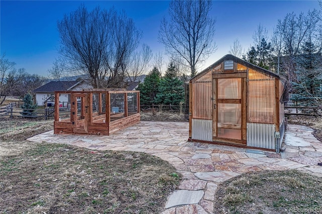 view of greenhouse with fence